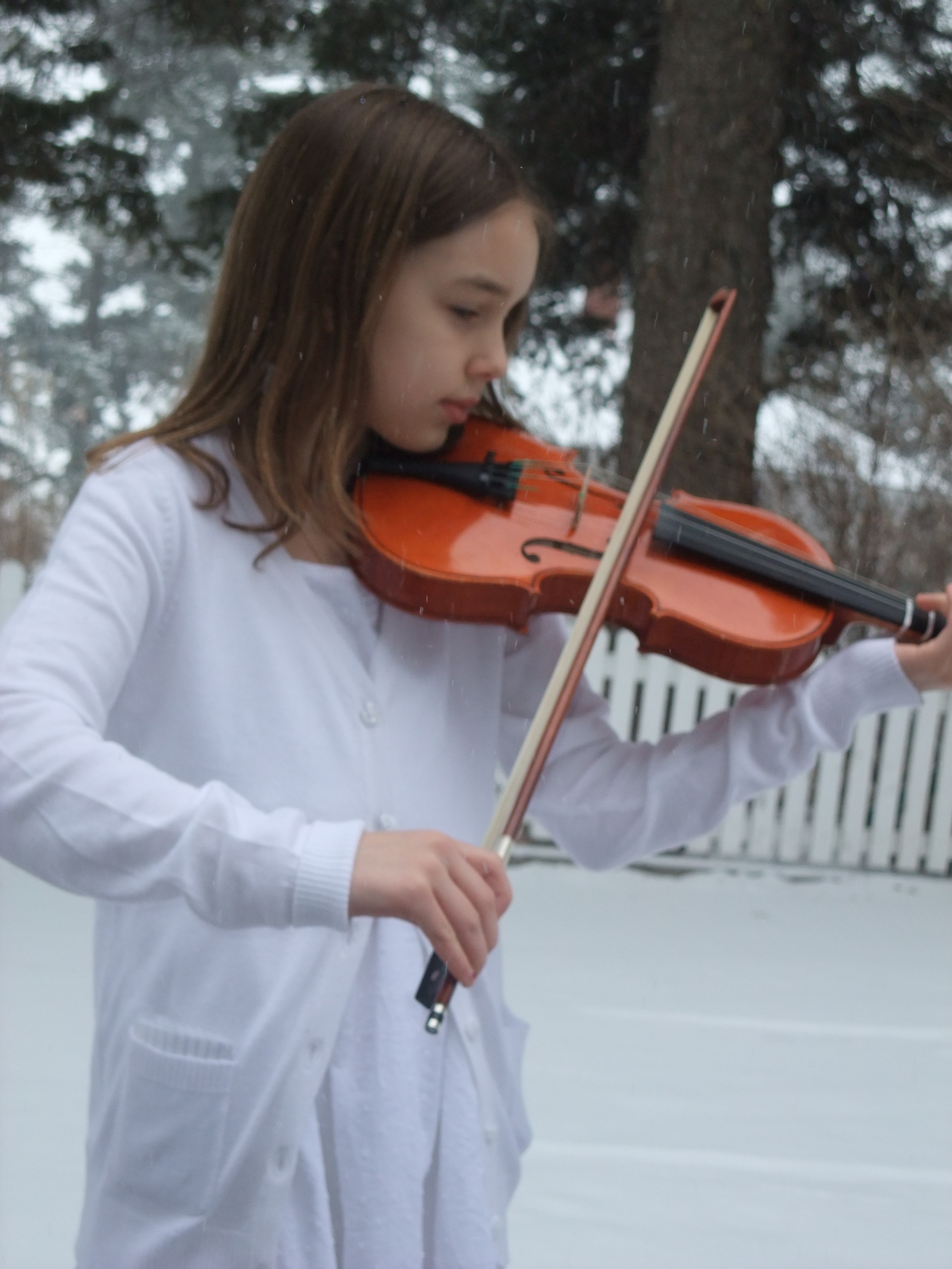 Hannah playing violin outside and unschool music training