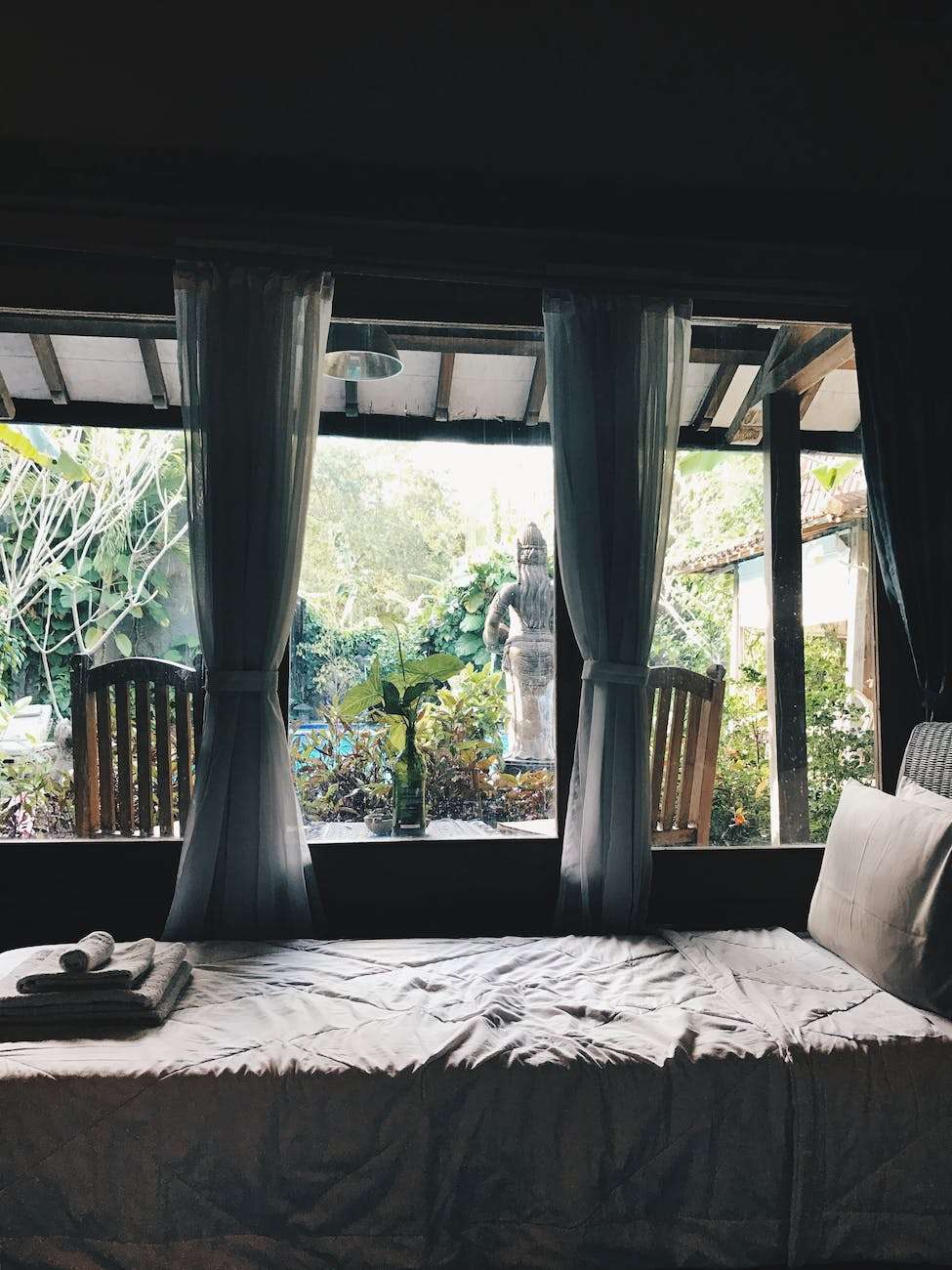 white bed near window