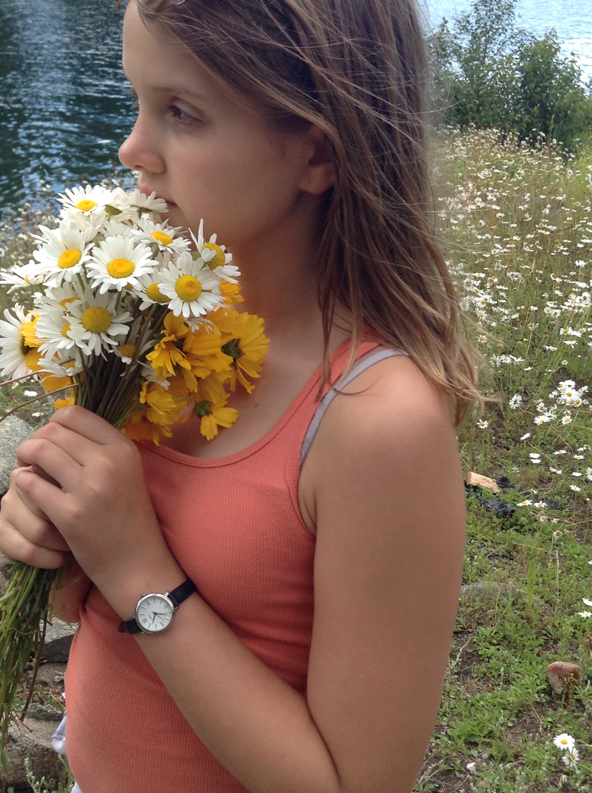Madelyn stopping to smell the daisies
