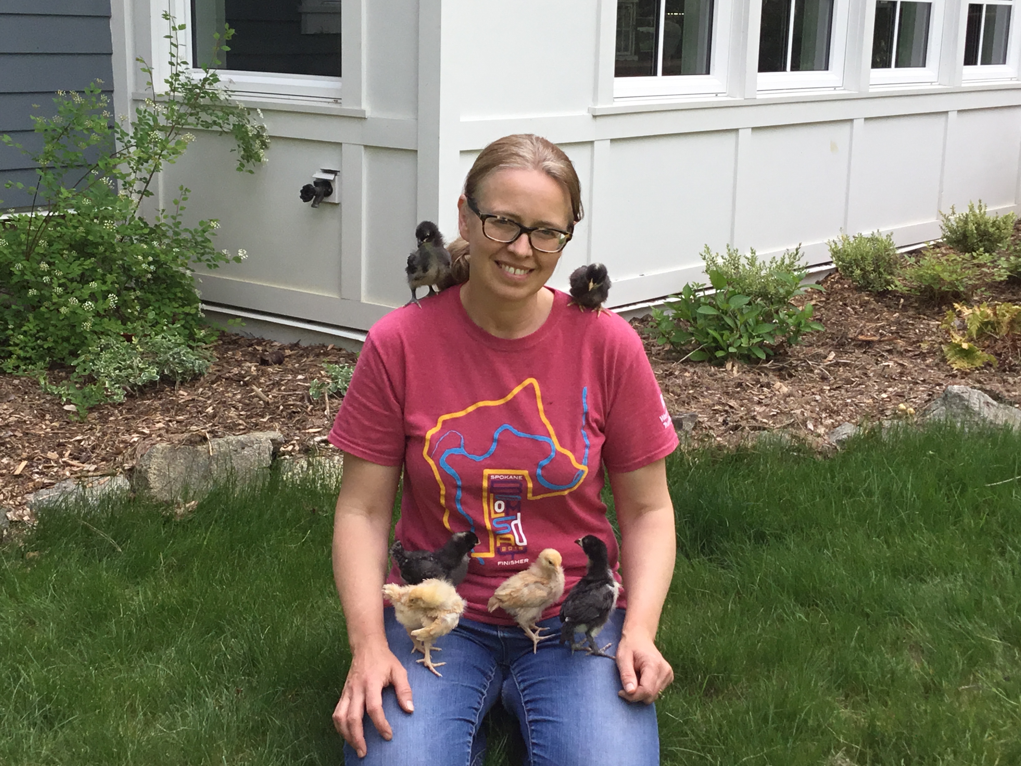 Me with my first batch of baby chicks on our homestead.