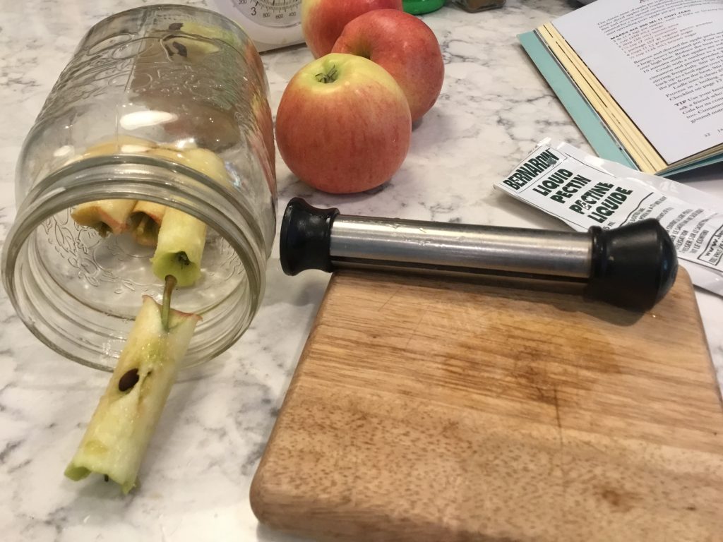 Apple cores stuffed in the glass jar