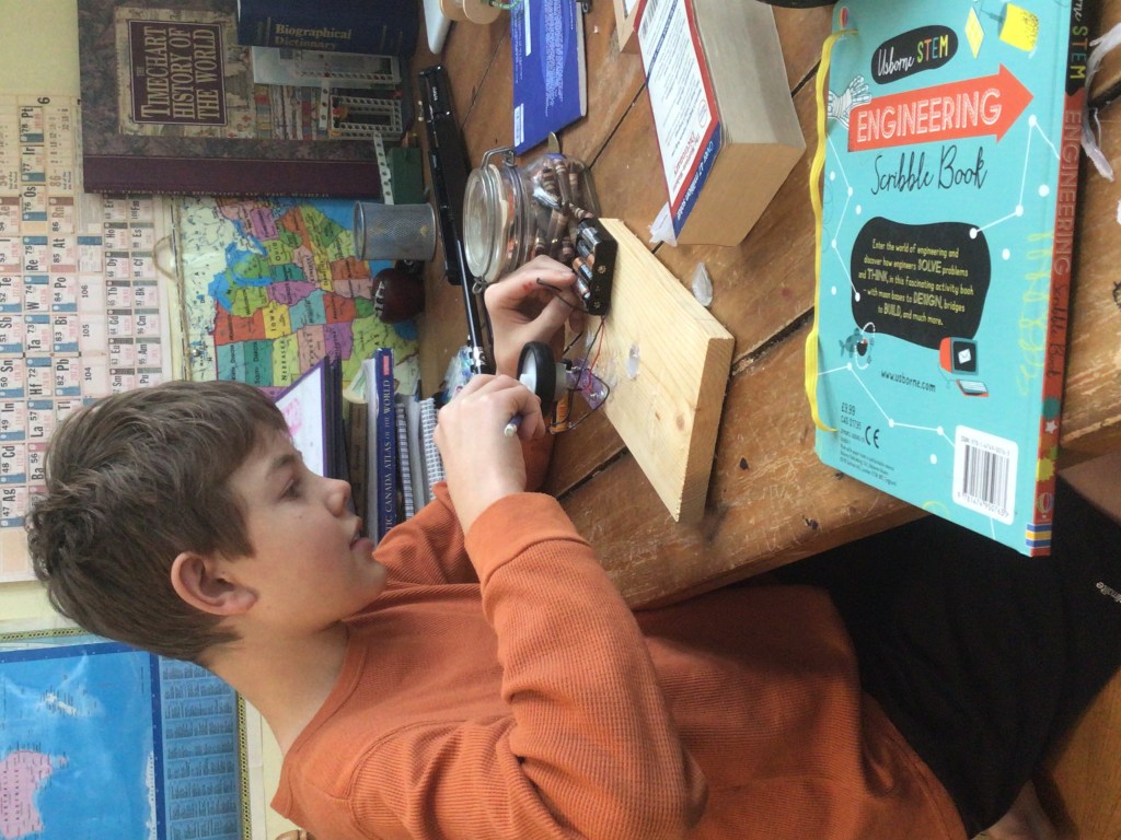 Zach building an electrical piece: learning science naturally