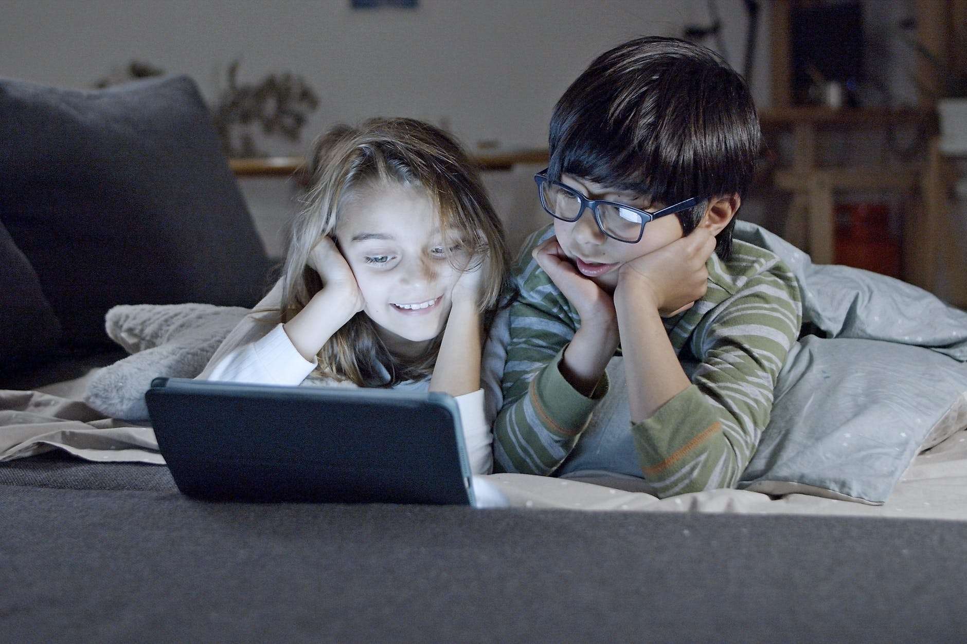 siblings watching on a tablet: planning for your new homeschool year