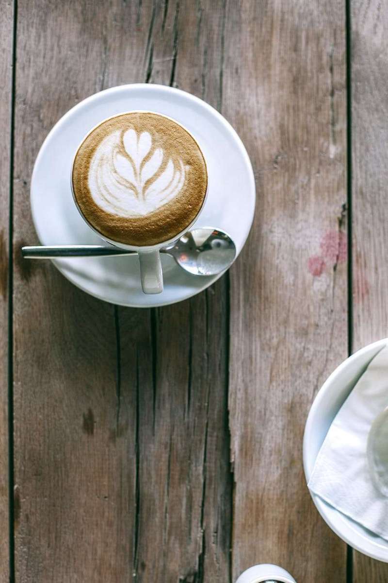 cup of hot coffee on table