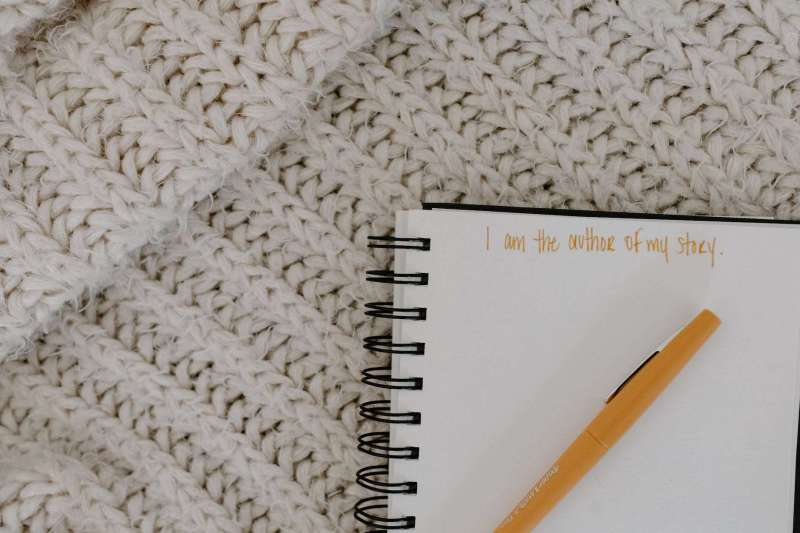 close up shot of a pen on a notebook