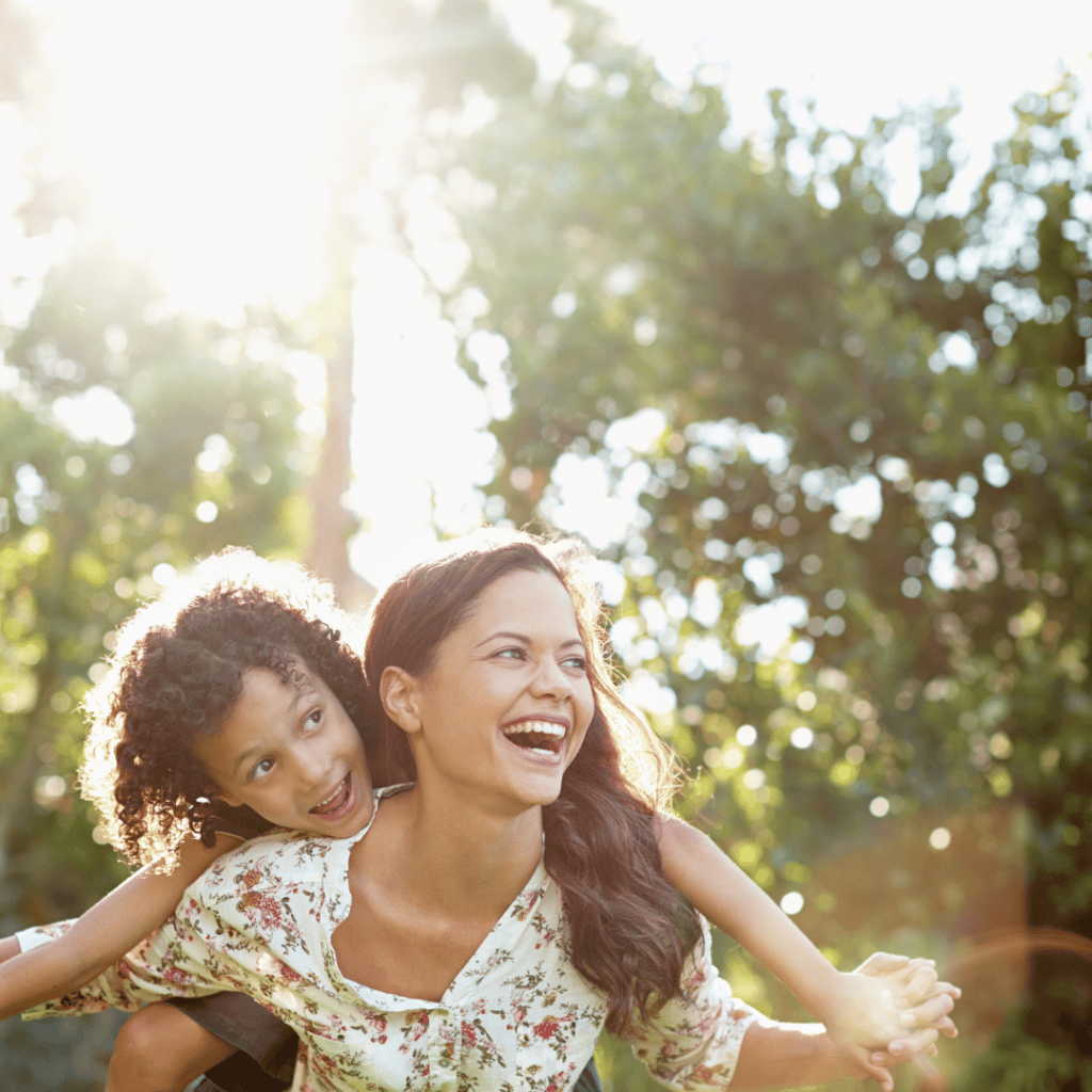 Mom carrying her child on her back, dreaming about the potential in our homeschool gratitude practice