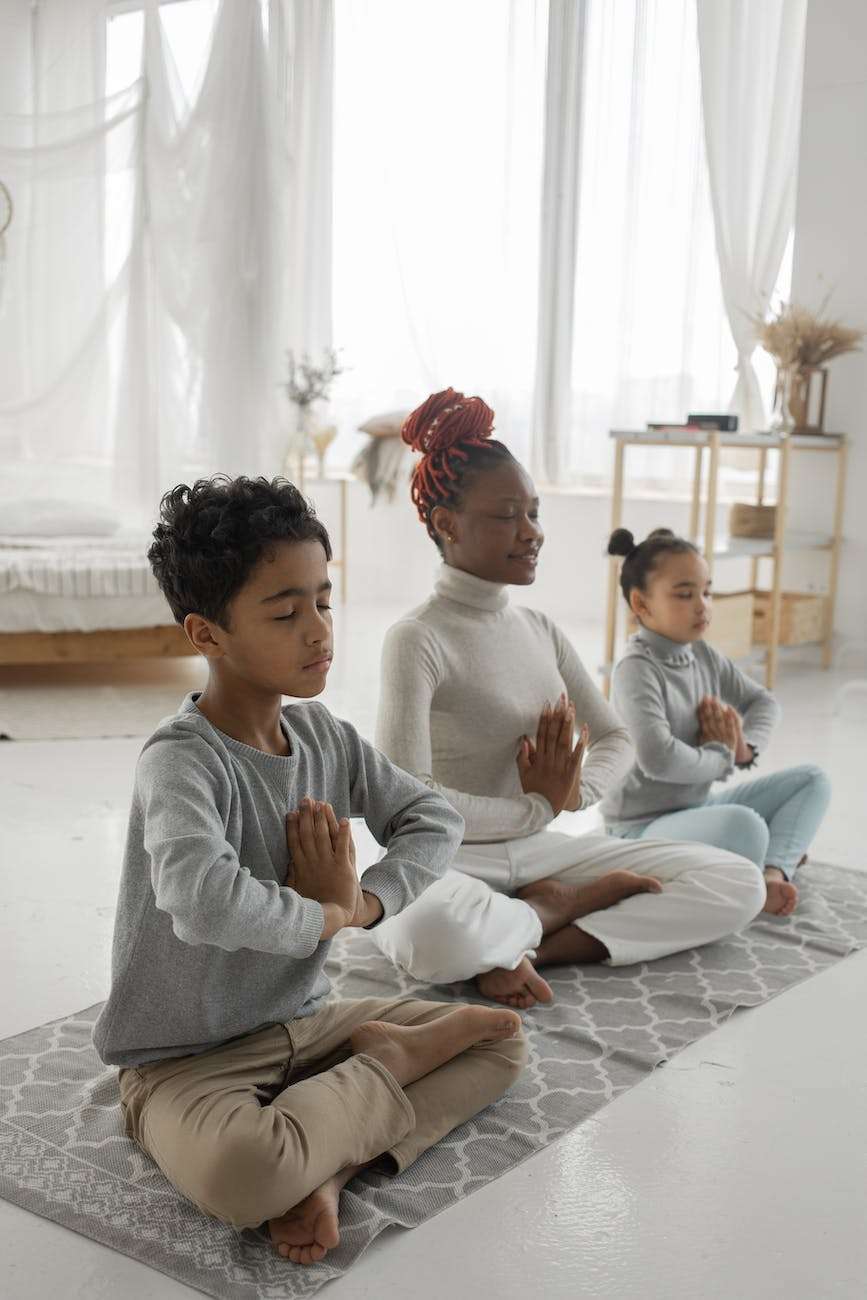 cute ethnic children with young mom meditating together with closed eyes at home: how to keep sane as a homeschool mom