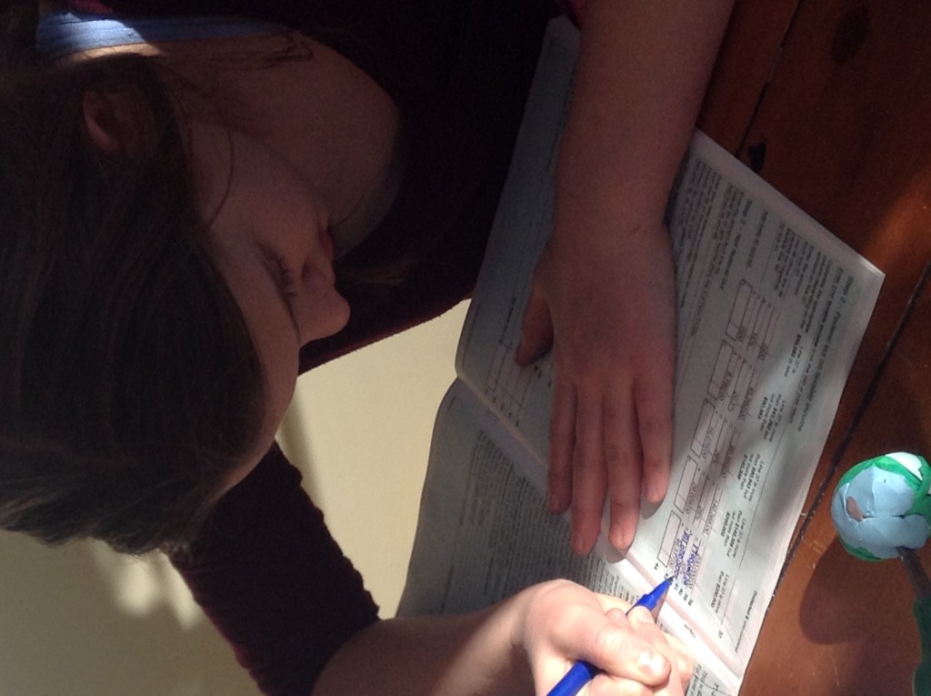 an unconventional homeschool writing activity, learning how to do her taxes is a way to teach a child to handwrite