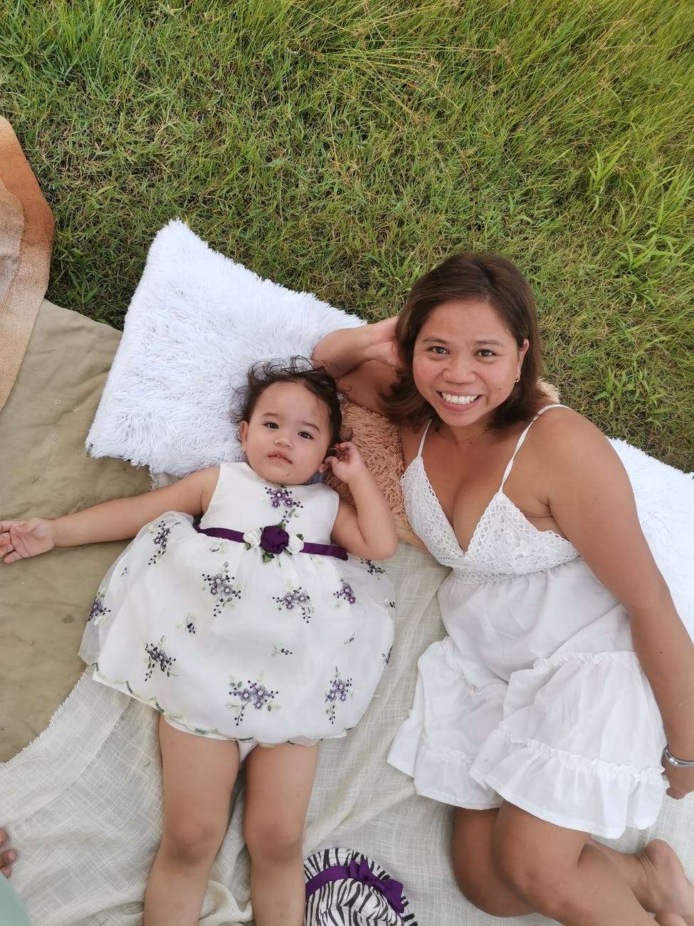overhead shot of a mother and her daughter in white dresses