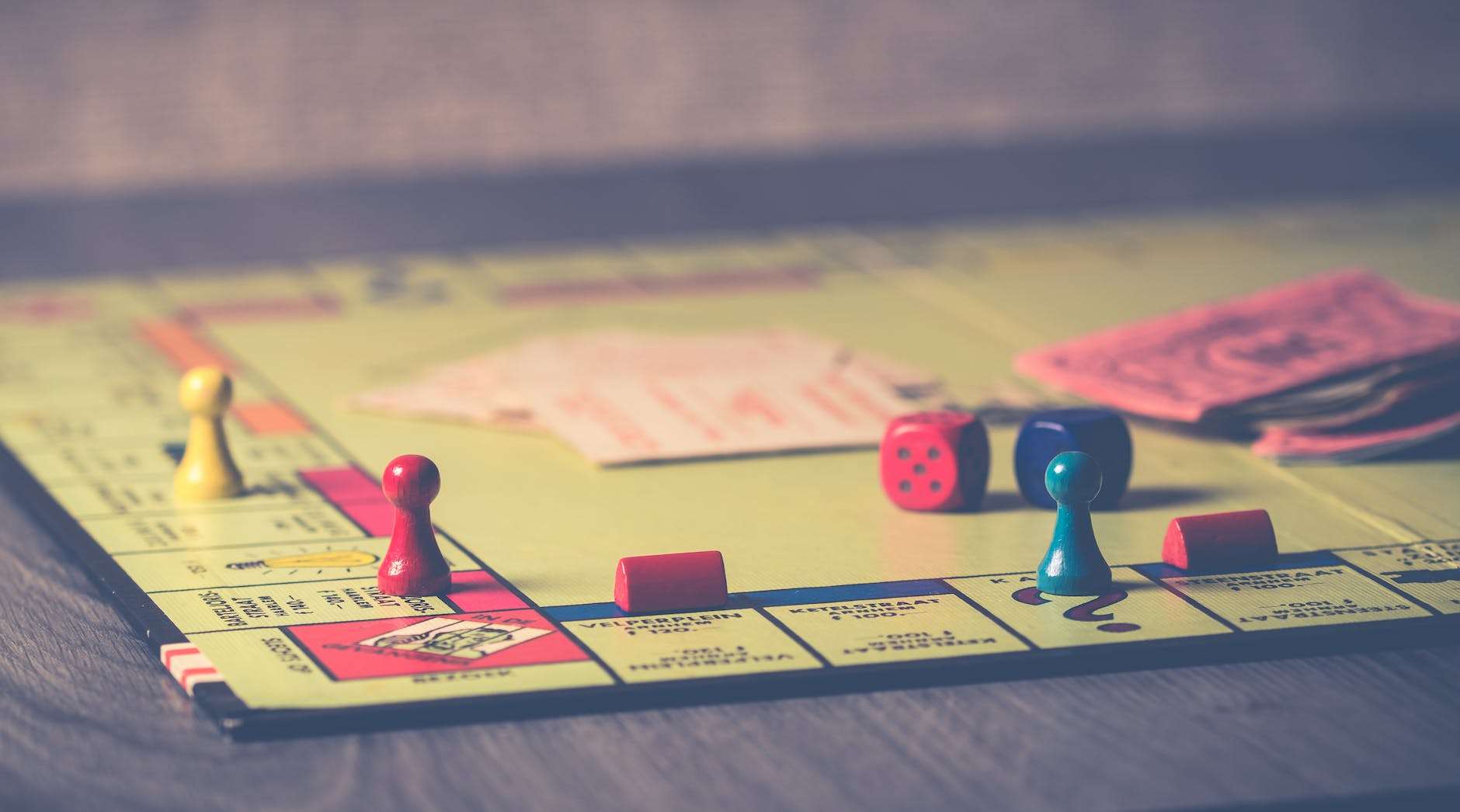 close up photo of monopoly board game: homeschool hygge practices