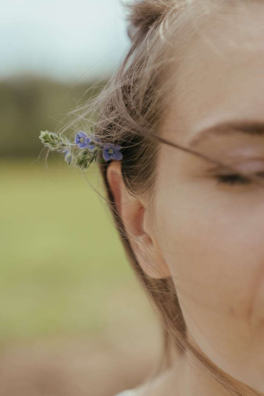 woman with blue flower on ear: We have an internal family, not just an external family