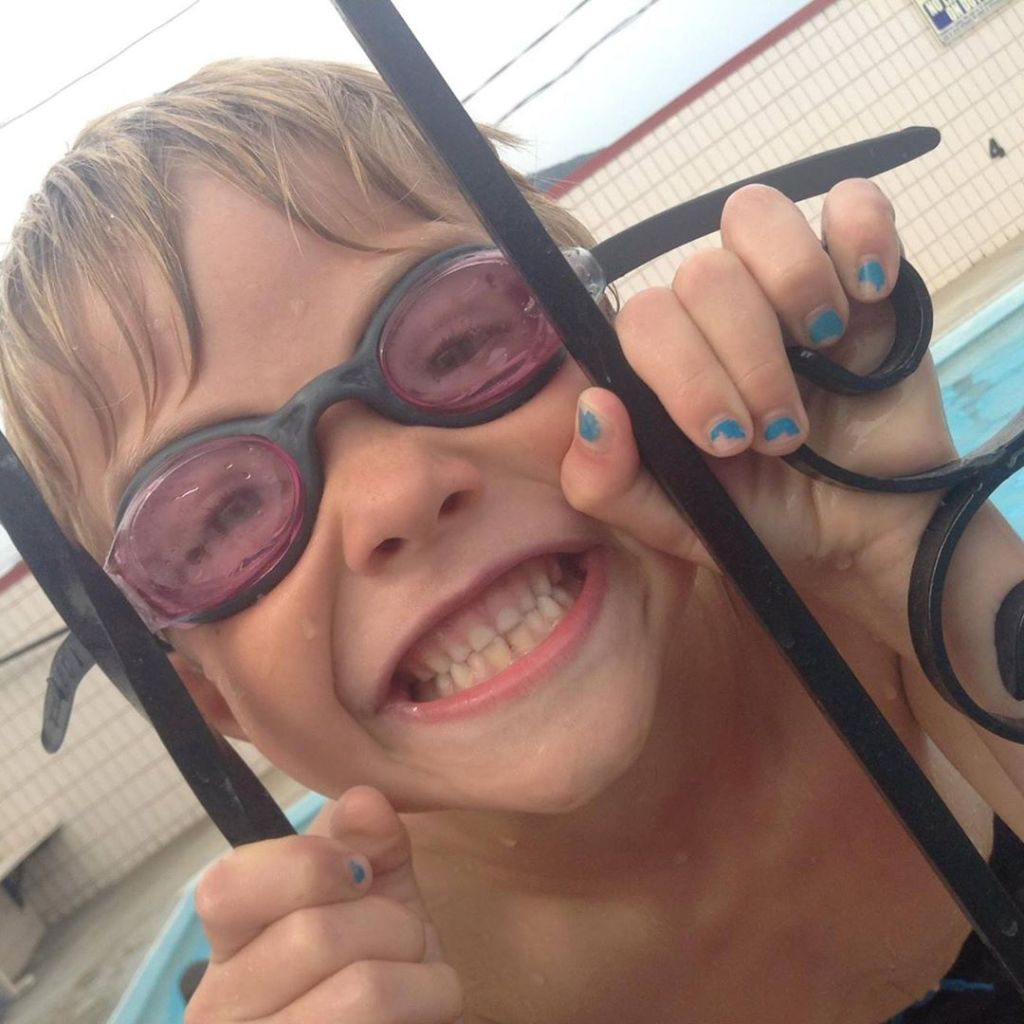 Zachary taking swim lessons.