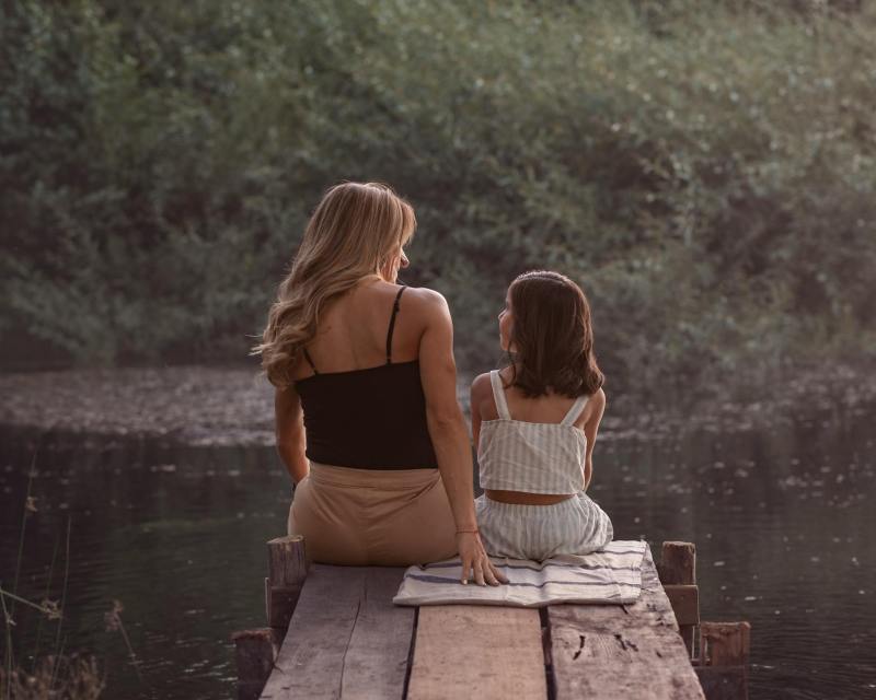 mother and daughter bonding at sunset