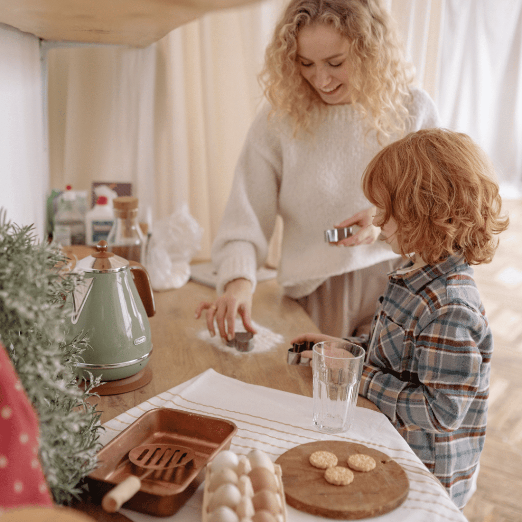 A homeschool mom and her child cooking together in the kitchen, learning to stop second-guessing as a homeschool mom while enjoying quality time.