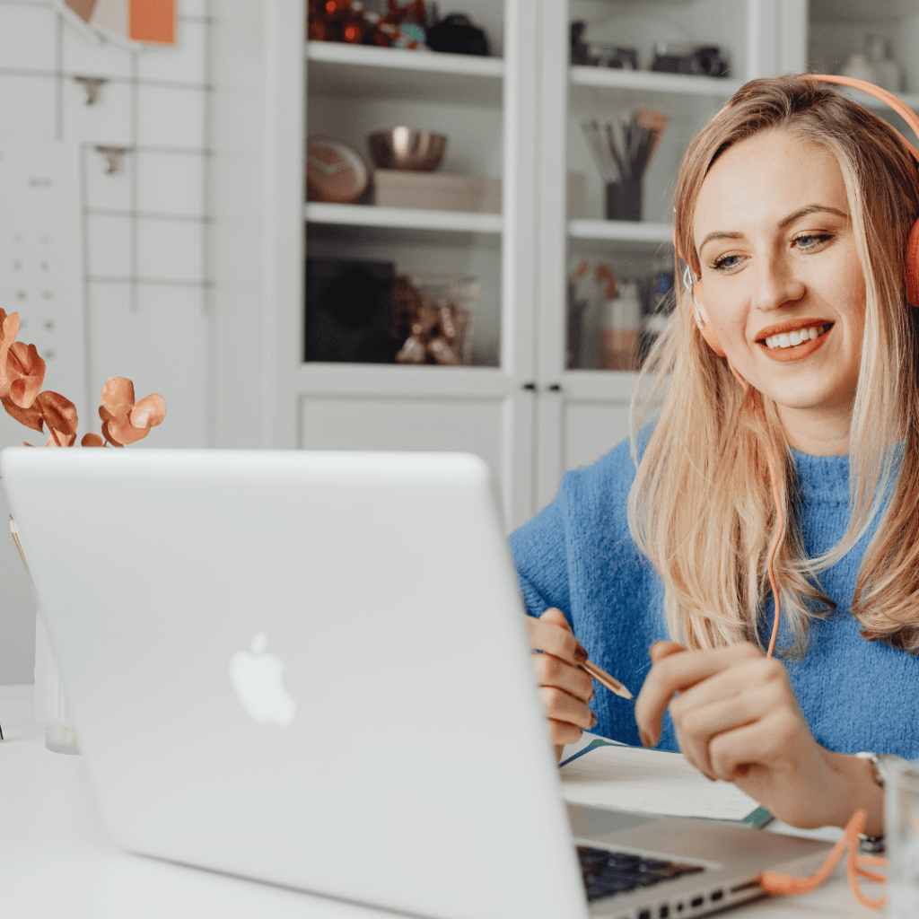 Homeschool mom working confidently at her laptop — building a business from the skills she developed educating her kids at home