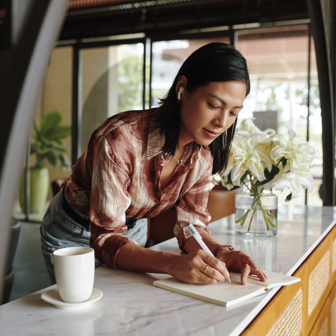 Homeschool mom journaling at a café — life coaching for homeschool moms helps you get clear on what you want