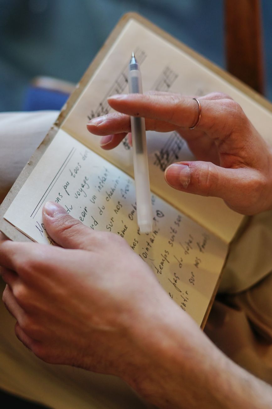 Close-up of a homeschool mom's handwritten notes, naming what's weighing on her