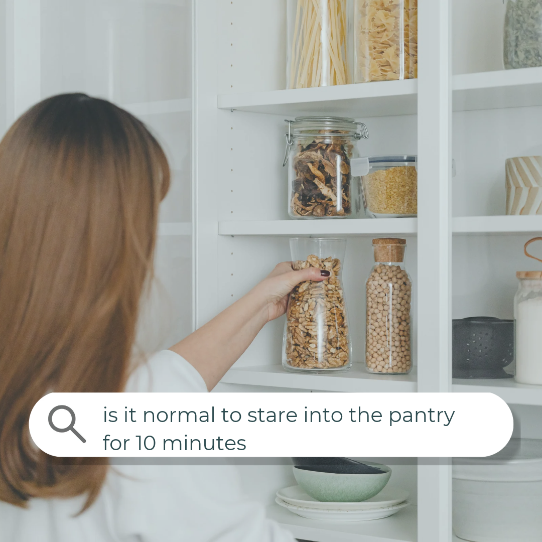 Woman reaching for a jar in her pantry, with a search bar reading "is it normal to stare into the pantry for 10 minutes"